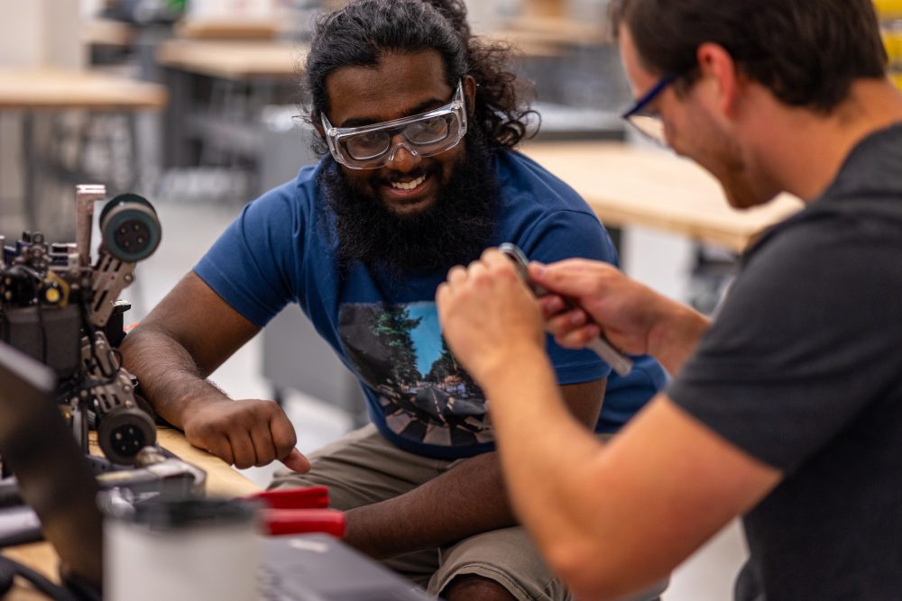 Senior engineering students work on their project in the Industrial Solutions Lab